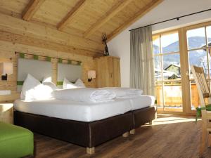 a bedroom with a large bed in a room at Great chalet in an idyllic location in Wagrain in Wagrain