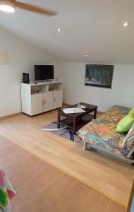 a living room with a bed and a table at Casa Evita in Sanxenxo +46 photos