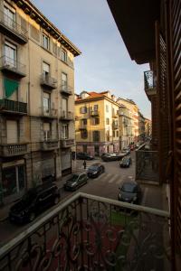 a view from a balcony of a city street with cars at Da Lisa all'ombra della Mole in Turin