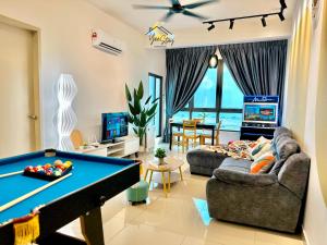 a living room with a pool table in it at SeaView PoolView CityView BaliResidence Video game 5minJonker in Melaka