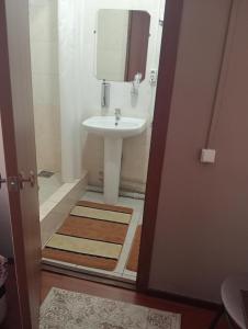 a bathroom with a sink and a mirror at Гостиница "SEMEY-CITY" in Semey +17 photos