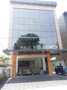 a building with a sign on top of it at PAUL RESIDENCY in Nedumbassery