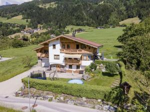 an aerial view of a house on a hill at Apartment with panoramic view in Ramsau
