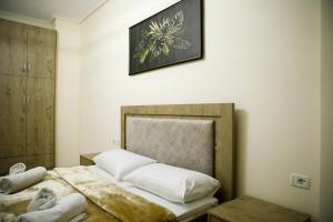 Ένα ή περισσότερα κρεβάτια σε δωμάτιο στο Nov's Apartment2