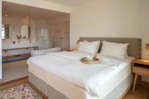 A bed or beds in a room at Coco-mat Athens BC