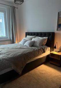 Ένα ή περισσότερα κρεβάτια σε δωμάτιο στο DeeM-LUX