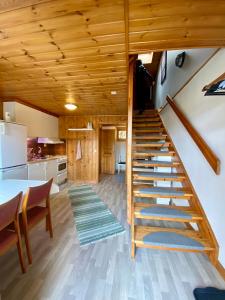 a spiral staircase in a tiny house at Lya med utsikt in Henån