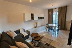 a living room with a couch and a table at Il Nido d'oro in Udine
