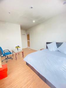 Katil atau katil-katil dalam bilik di Pall Residency