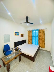 Katil atau katil-katil dalam bilik di Pall Residency