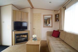 Istumisnurk majutusasutuses modern 3 bedroom 2 bathroom caravan with decking
