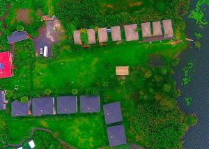 an overhead view of a yard with houses and trees at Lake Chahafi Resort in Kisoro