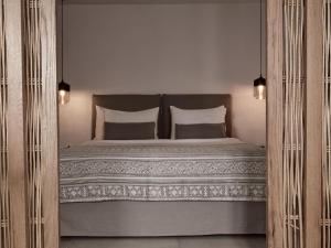 מיטה או מיטות בחדר ב-Boho Suites