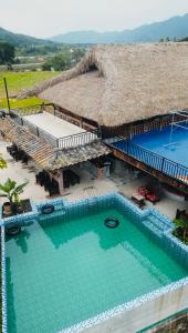 an aerial view of a resort with a swimming pool at Local Ban Bang Homestay - Motorbike rental and Tour in Ha Giang