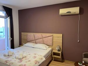 Postel nebo postele na pokoji v ubytování Apartments Adrian
