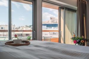 Postel nebo postele na pokoji v ubytování Coco-mat Athens BC + 37 fotografií