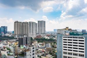 a view of a city with tall buildings at Soho Apartment By Convinia in Ho Chi Minh City