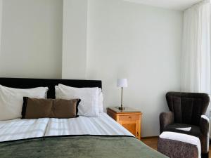 Кровать или кровати в номере Luotsi 1911 Suite