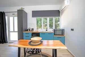 Kuchyň nebo kuchyňský kout v ubytování Armoniahousesuites