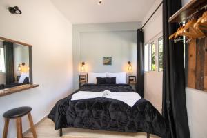 Postel nebo postele na pokoji v ubytování Armoniahousesuites