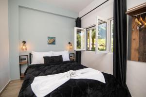 Postel nebo postele na pokoji v ubytování Armoniahousesuites + 37 fotografií