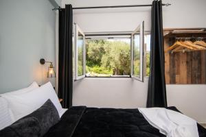 Postel nebo postele na pokoji v ubytování Armoniahousesuites