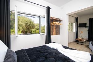 Postel nebo postele na pokoji v ubytování Armoniahousesuites