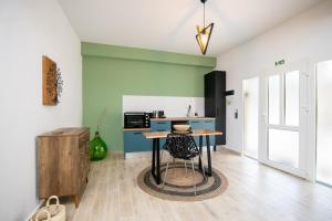Kuchyň nebo kuchyňský kout v ubytování Armoniahousesuites
