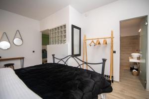 Postel nebo postele na pokoji v ubytování Armoniahousesuites