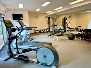 a gym with several treadmills and exercise machines at Kata Sea View Sanctuary in Kata Beach