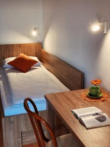 a room with a table and a bed and a table and a table sidx sidx at Apartma Domačija Bole in Sežana