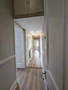an empty hallway of a house with an open door at Studio flat in York in York