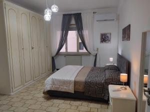 A bed or beds in a room at Vallese Holiday Home Apartment Maiori