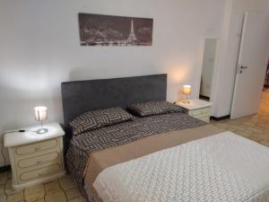 A bed or beds in a room at Vallese Holiday Home Apartment Maiori