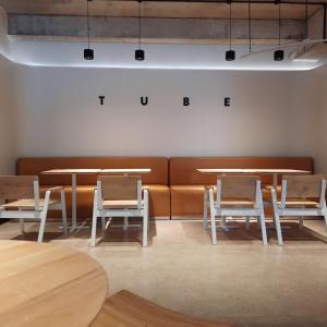 a room with tables and chairs and a couch at Try Residence, The Elysée Koh Pich in Phnom Penh