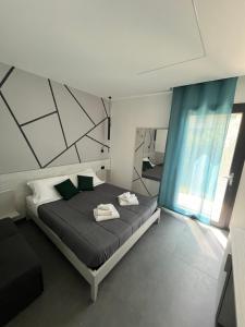 Postel nebo postele na pokoji v ubytování B&B A due passi dal mare