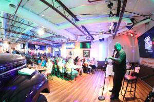 a man standing in front of a crowd in a restaurant at Ramada by Wyndham Kingman in Kingman +37 photos