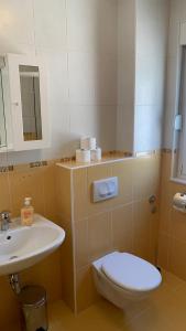 a bathroom with a toilet and a sink at Luxury Apartments Villa Lenka in Podstrana +36 photos