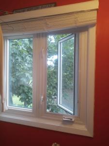 een raam in een rode muur met een vensterbank bij ROOM for Rent in Mississauga