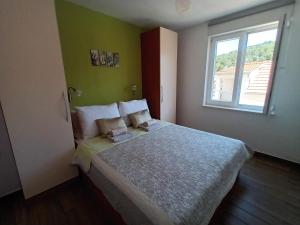 Postel nebo postele na pokoji v ubytování Apartment Teuta