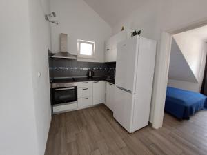 Kuchyň nebo kuchyňský kout v ubytování Apartment Teuta