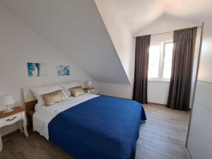 Postel nebo postele na pokoji v ubytování Apartment Teuta