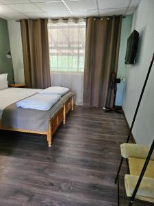 A bed or beds in a room at Orehite-Family Hotel ,Food & Pool