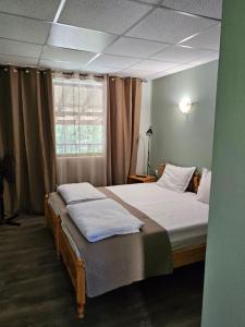 A bed or beds in a room at Orehite-Family Hotel ,Food & Pool