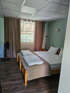 A bed or beds in a room at Orehite-Family Hotel ,Food & Pool