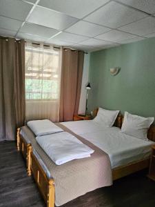 A bed or beds in a room at Orehite-Family Hotel ,Food & Pool