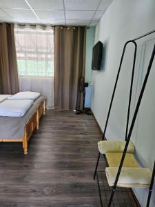 A bed or beds in a room at Orehite-Family Hotel ,Food & Pool