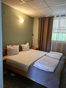 A bed or beds in a room at Orehite-Family Hotel ,Food & Pool