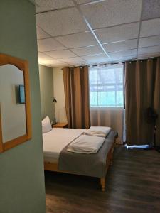 A bed or beds in a room at Orehite-Family Hotel ,Food & Pool