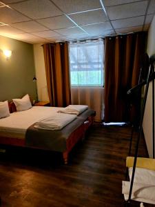 A bed or beds in a room at Orehite-Family Hotel ,Food & Pool